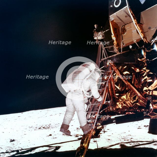 Edwin Buzz Aldrin descends the steps of the Lunar Module ladder to walk on the Moon, 1969.Artist: NASA