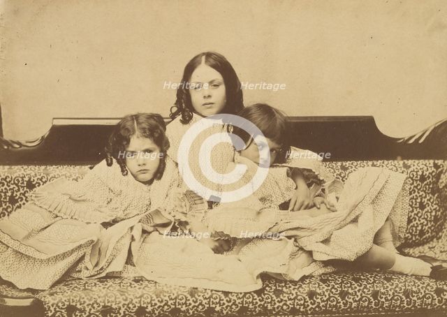 Edith, Ina and Alice Liddell on a Sofa, Summer 1858. Creator: Lewis Carroll.