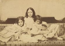 Edith, Ina and Alice Liddell on a Sofa, Summer 1858. Creator: Lewis Carroll