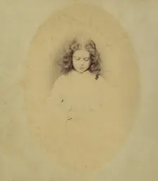 Edith Liddell Seated Beside a Vase of Foxgloves, 1860. Creator: Lewis Carroll
