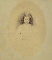 Edith Liddell Seated Beside a Vase of Foxgloves, 1860. Creator: Lewis Carroll