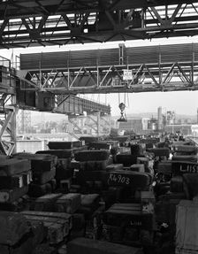 Eectromagnet above steel ingots, Park Gate Iron & Steel Co, Rotherham, South Yorkshire, 1964. Creator: Michael Walters