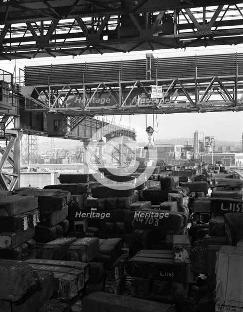 Eectromagnet above steel ingots, Park Gate Iron & Steel Co, Rotherham, South Yorkshire, 1964. Creator: Michael Walters.