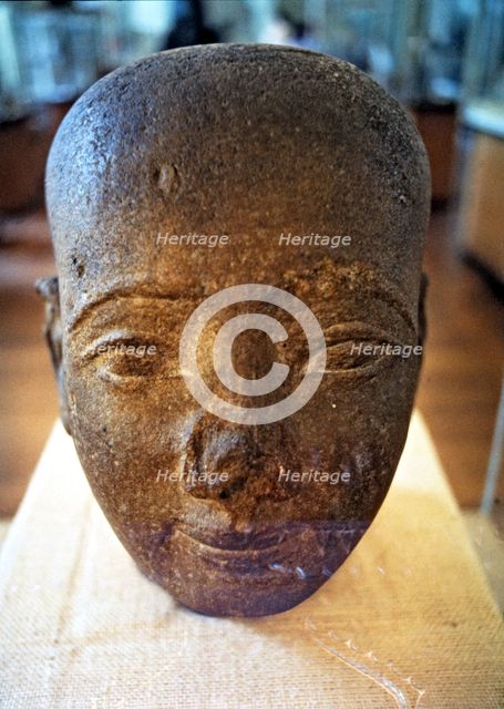 Egyptian art. Head in red granite from the New Kingdom era.