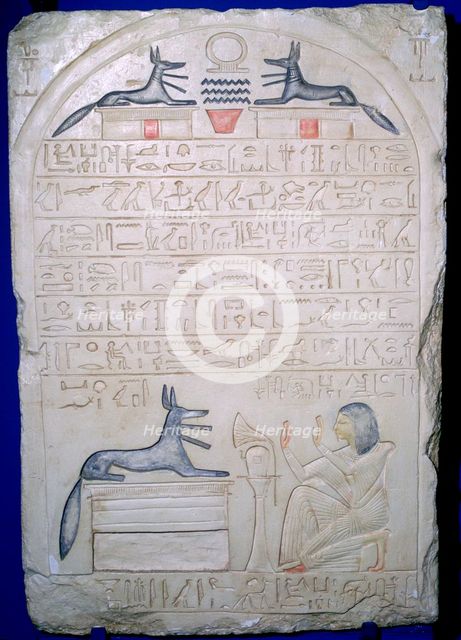 Egyptian elief stele of a man adoring Anubis. Artist: Unknown