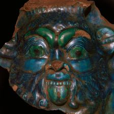 Egyptian faience head of Bes