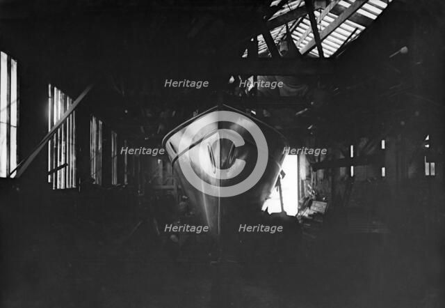 Egyptian motor launch in shed, 1911. Creator: Kirk & Sons of Cowes.