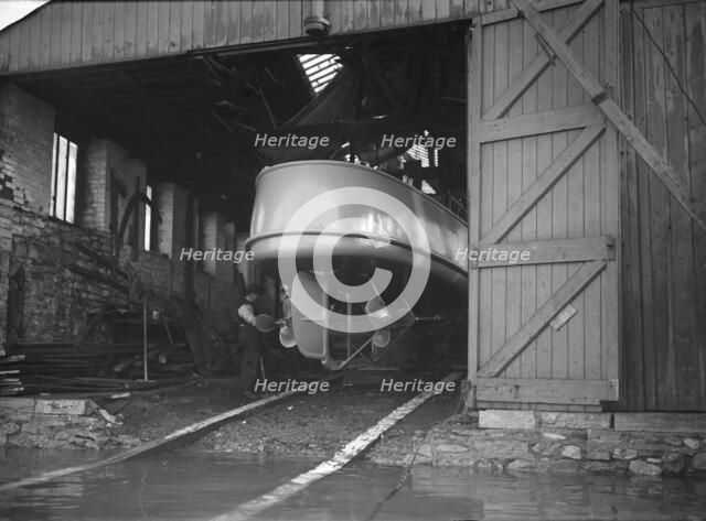 Egyptian motor launch in shed, 1911. Creator: Kirk & Sons of Cowes.