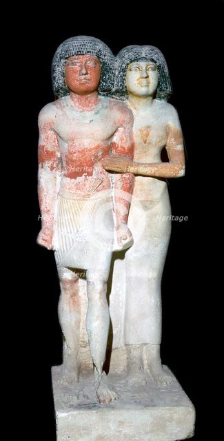 Egyptian sculpture of a man and his wife. Artist: Unknown