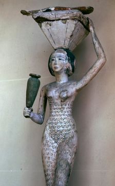 Egyptian statuette of a woman bearing offerings, 22nd century BC