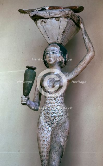 Egyptian statuette of a woman bearing offerings, 22nd century BC. Artist: Unknown