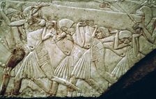 Egyptian relief of men moving a stone lintel