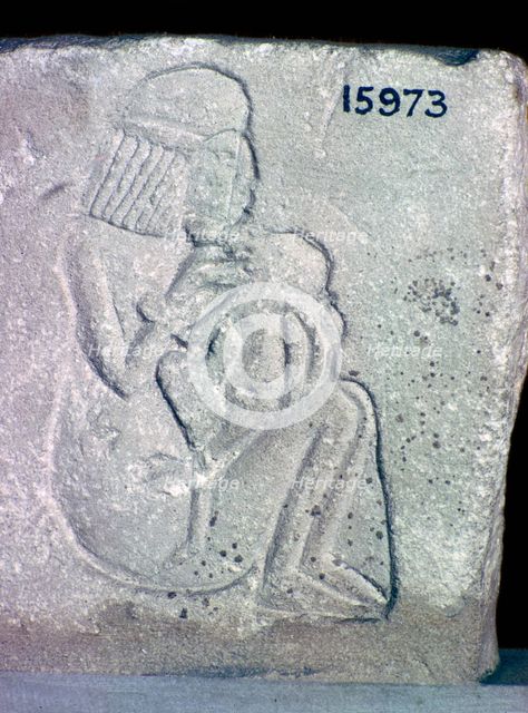 Egyptian relief of a woman suckling a child, 14th century BC. Artist: Unknown