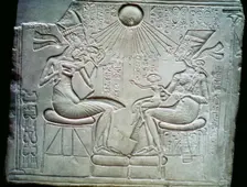 Egyptian relief of Akhenaten and Nefertiti holding their daughters, 14th century BC
