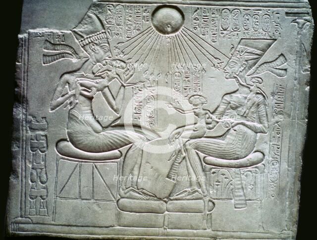 Egyptian relief of Akhenaten and Nefertiti holding their daughters, 14th century BC. Artist: Unknown