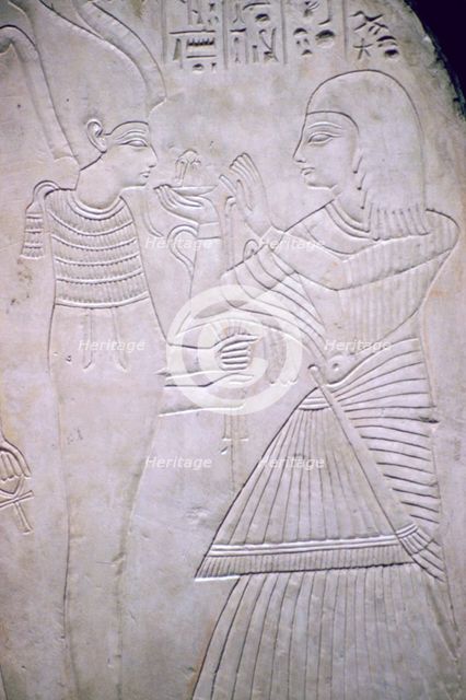 Egyptian relief of Amon making an offering to Osiris. Artist: Unknown