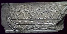 Egyptian relief of fishing from a boat with a net