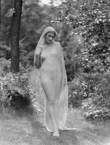 Egger, Gabrielle, Miss, standing outdoors, between 1926 and 1930. Creator: Arnold Genthe