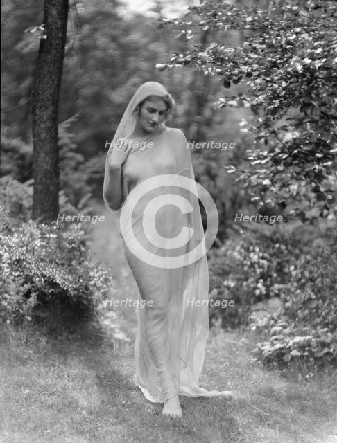 Egger, Gabrielle, Miss, standing outdoors, between 1926 and 1930. Creator: Arnold Genthe.