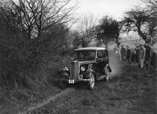 EGH Arnold's Ford Model Y, Sunbac Colmore Trial, near Winchcombe, Gloucestershire, 1934. Artist: Bill Brunell