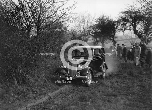 EGH Arnold's Ford Model Y, Sunbac Colmore Trial, near Winchcombe, Gloucestershire, 1934. Artist: Bill Brunell.