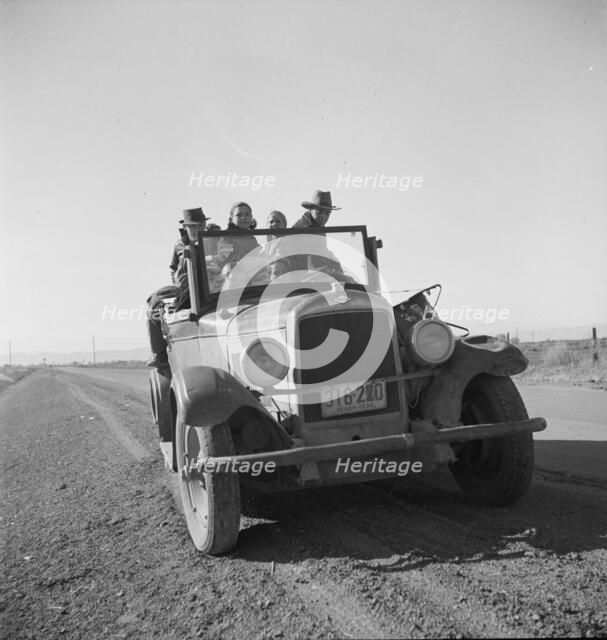 Eight related persons...in search of employment as pea pickers, on US80, Imperial Valley, CA, 1939. Creator: Dorothea Lange.