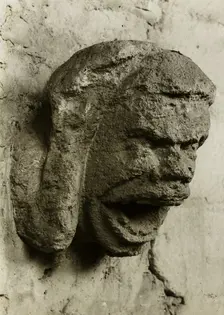 Ely Cathedral: Head in South Nave Triforium, c. 1891. Creator: Frederick Henry Evans