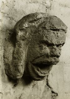 Ely Cathedral: Head in South Nave Triforium, c. 1891. Creator: Frederick Henry Evans