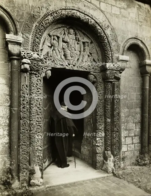 Ely Cathedral: Prior's Door, with Bedesman, 1891. Creator: Frederick Henry Evans.