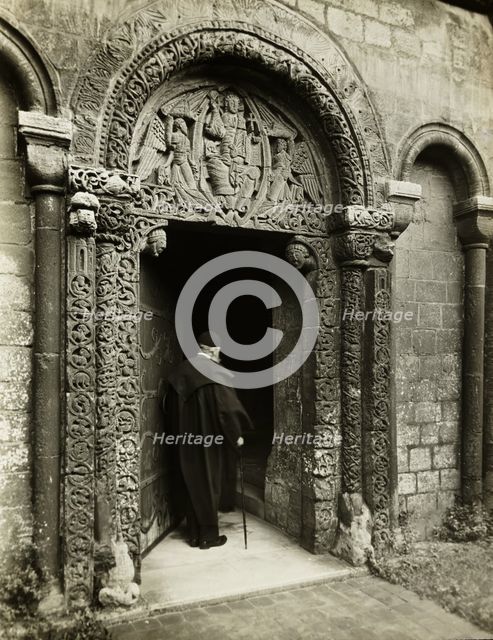 Ely Cathedral: Prior's Door, with Bedesman, 1891. Creator: Frederick Henry Evans.