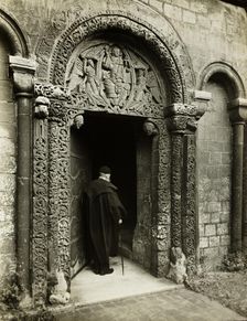 Ely Cathedral: Prior's Door, with Bedesman, 1891. Creator: Frederick Henry Evans