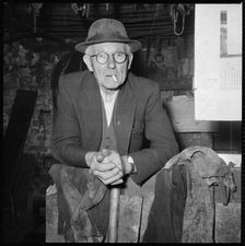 Elderly man posed in a workshop, 1967. Creator: Eileen Deste