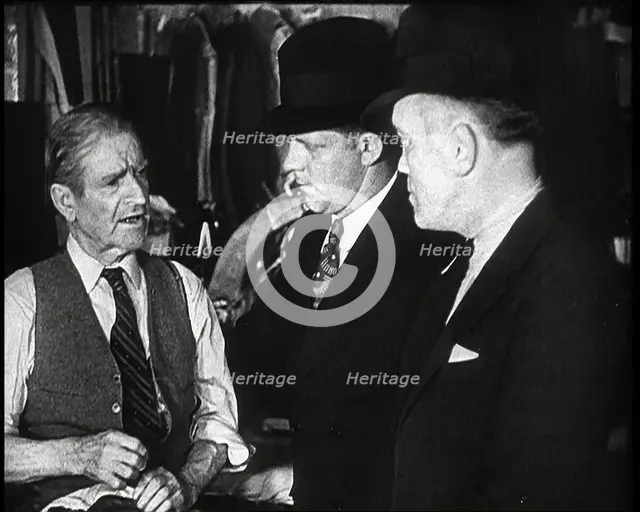 Elderly Male Civilian Being Threatened For Protection Money By Two Male Civilians, 1932. Creator: British Pathe Ltd.
