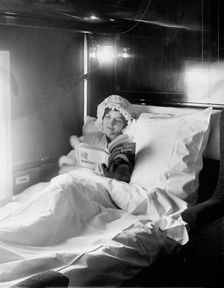 Electric-lighted berth on a deluxe overland limited train, between 1910 and 1920. Creator: William H. Jackson