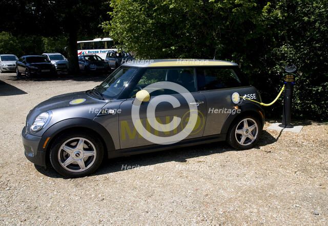 Electric Mini at battery charging point 2011 Artist: Unknown.