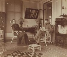 Eleanor and Frederick Pray, seated in the veranda room, Dom Smith, Vladivostok, Russia, 1900. Creator: Maud Morphew