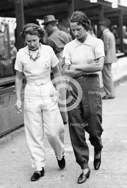 Elsie Wisdom (right) with Kaye Petre in pits at Brooklands. Creator: Unknown.