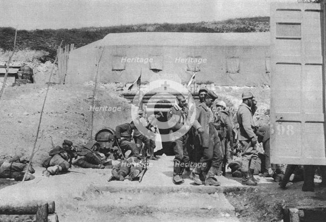 ''Epaves du combat; Blesses allemands au poste d'evacuation', 1916 (1924) Creator: Unknown.