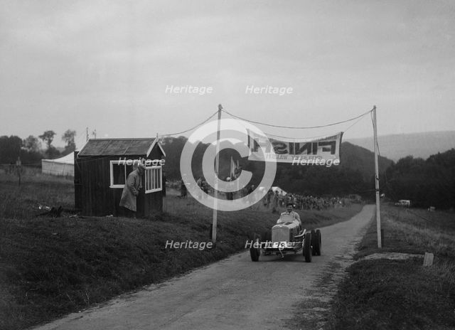 ERA of Raymond Mays at the finishing line of the Shelsley Walsh Hillclimb, Worcestershire, 1935. Artist: Bill Brunell.