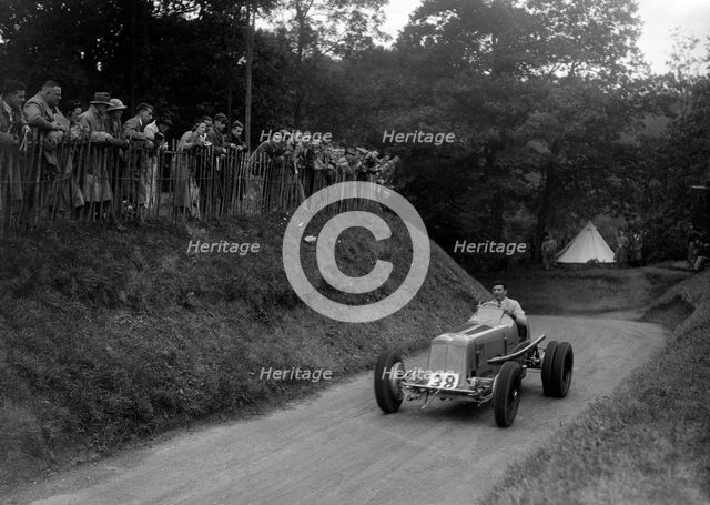 ERA of Raymond Mays competing in the Shelsley Walsh Hillclimb, Worcestershire, 1935. Artist: Bill Brunell.