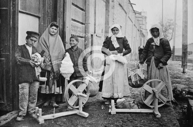 Erivan : Taking home spinning wheels & cotton, between c1915 and c1920. Creator: Bain News Service.