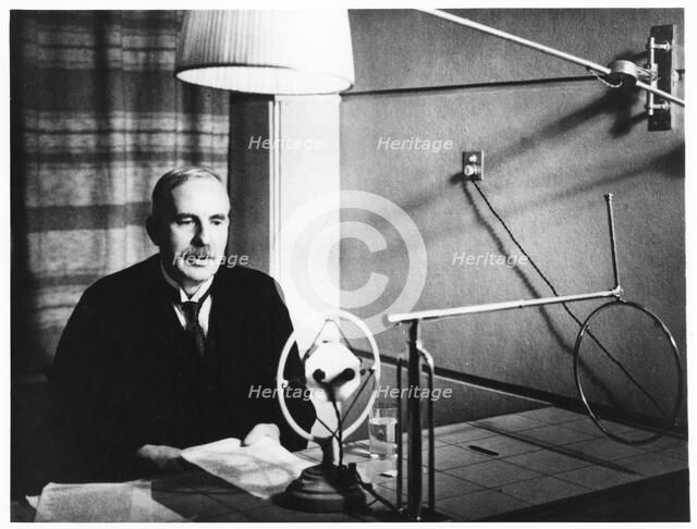 Ernest Rutherford broadcasting during a home visit to New Zealand in 1926.   Artist: Anon