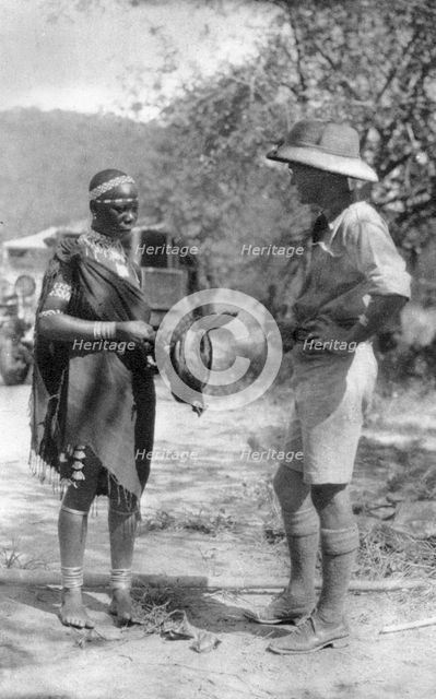 Errol Hinds making a deal in chickens, Wankie to Victoria Falls, Southern Rhodesia, 1925 (1927). Artist: Thomas A Glover