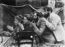 Esther Pissarro, Alice Isaacson, Lucien and Georges Pissarro pretending to be a train, 1890. Creator: Unknown