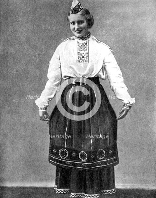 Estonian woman in traditional dress, 1936. Artist: Unknown