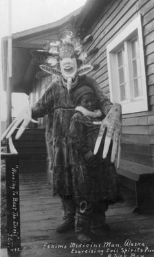 Eskimo medicine man and sick boy, between c1900 and c1930. Creator: Unknown