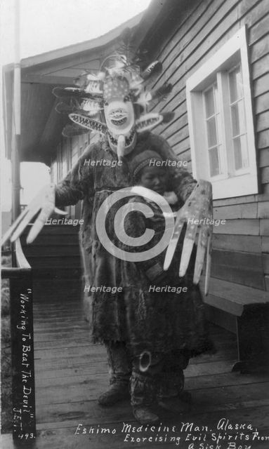 Eskimo medicine man and sick boy, between c1900 and c1930. Creator: Unknown.