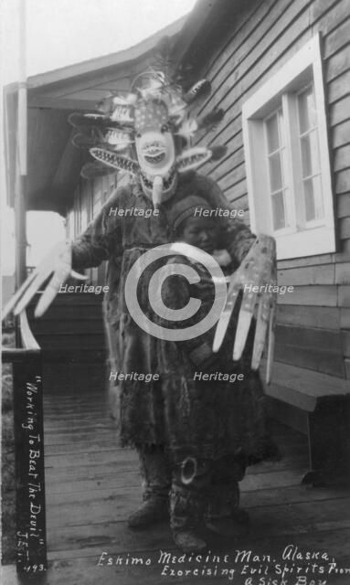 Eskimo medicine man and sick boy, between c1900 and c1930. Creator: Unknown.