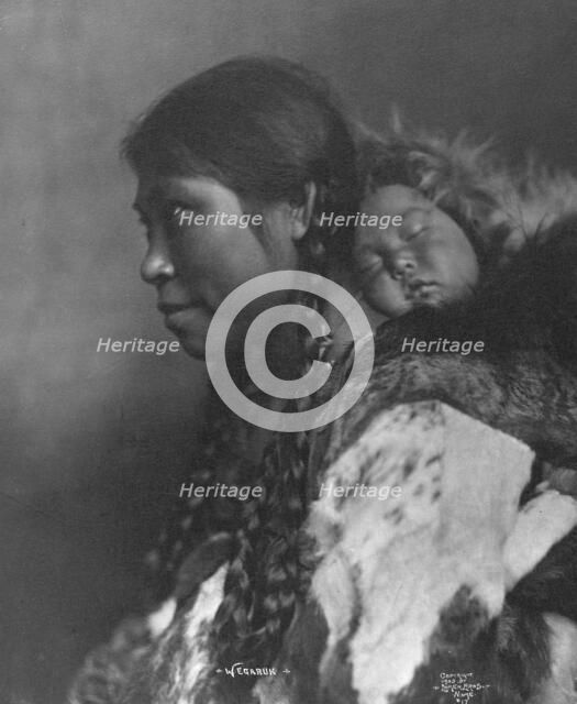 Eskimo mother and child , c1905, printed (1923?). Creator: Lomen Brothers.