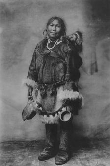 Eskimo mother carrying a child on her back, 1916(?). Creator: Unknown